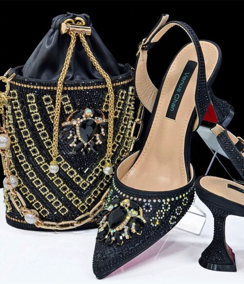 A pair of black embellished slingback heels with matching beaded drawstring bag featuring gold chains and gemstone accents