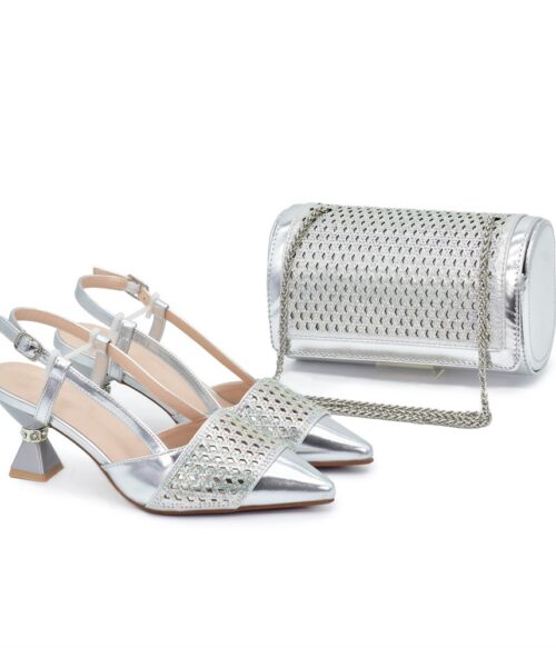 A pair of silver pointed-toe slingback heels with geometric cutout mesh design, paired with a rounded silver clutch with metallic finish and chain strap.