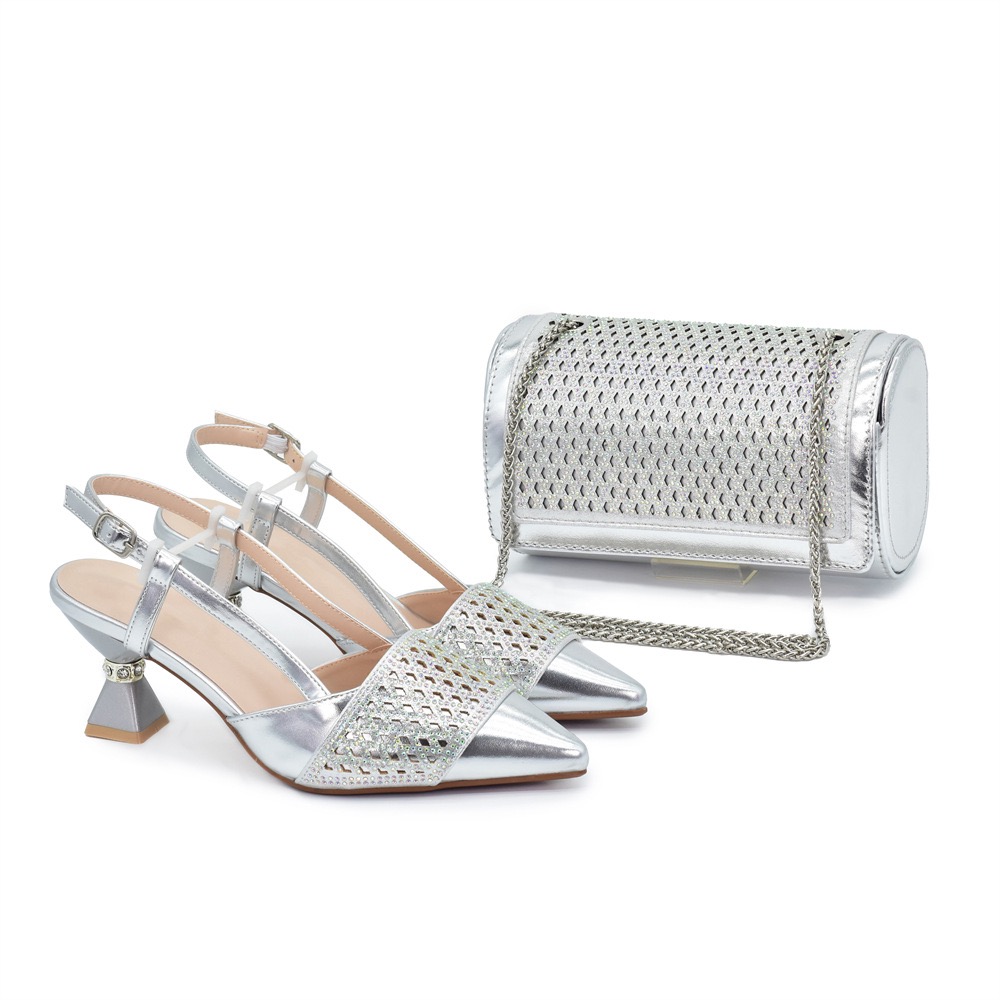 A pair of silver pointed-toe slingback heels with geometric cutout mesh design, paired with a rounded silver clutch with metallic finish and chain strap.